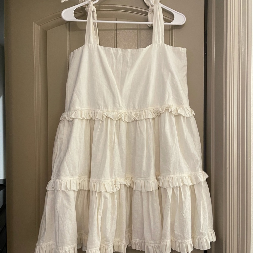 White sundress, sleeves are tied bows